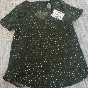 Dark green blouse with white polka dots